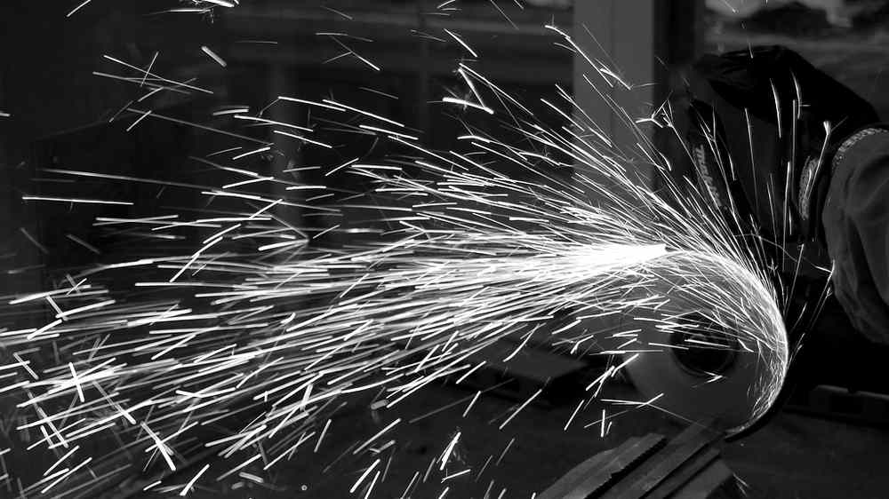 Sparks flying from a metal grinder